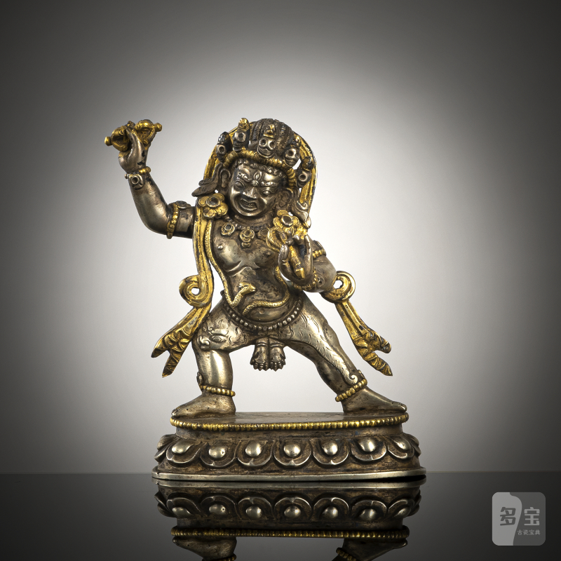 A parcel-gilt lilver figure of Vajrapani